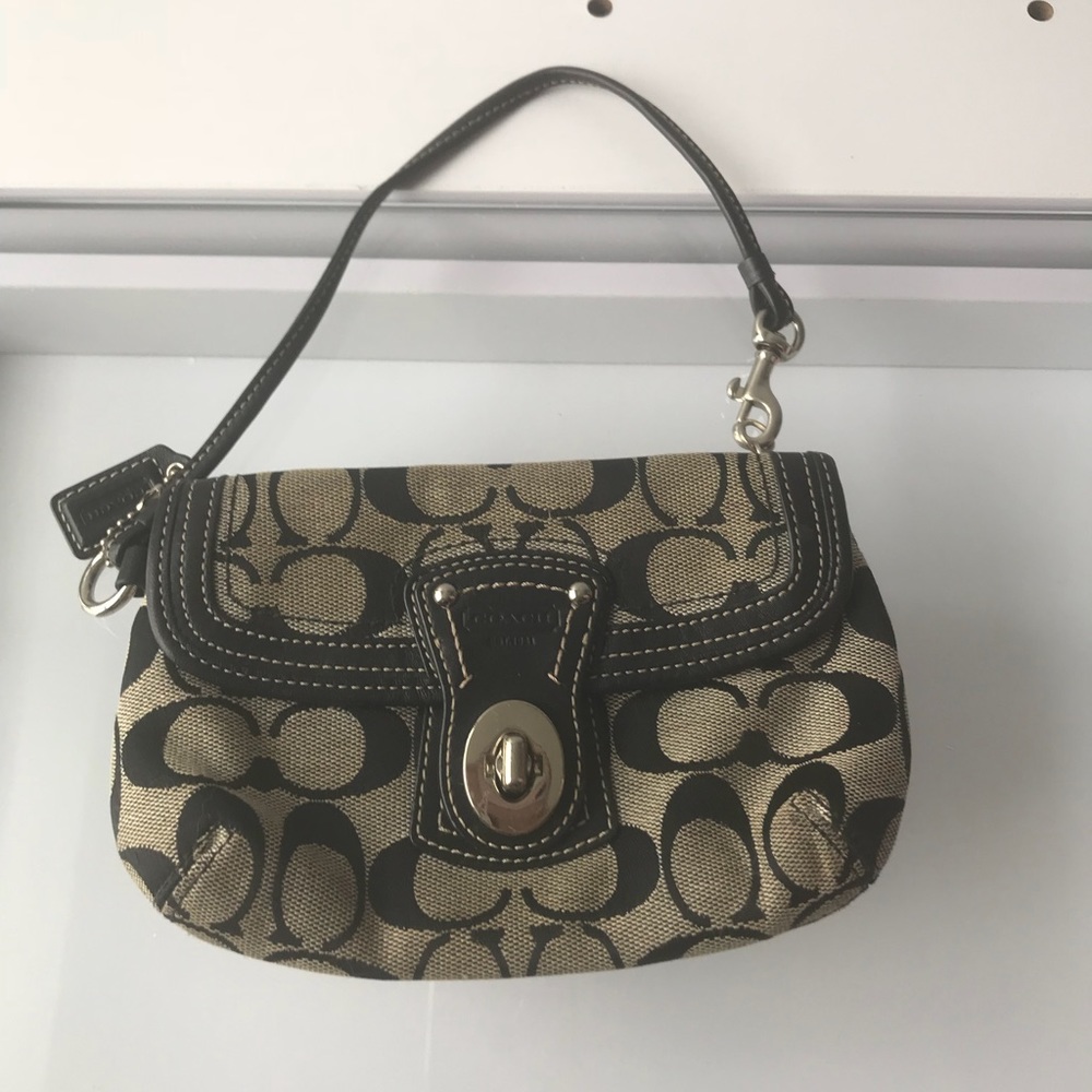 Pre-own Small Black & Tan Canvas Coach Wristlet.